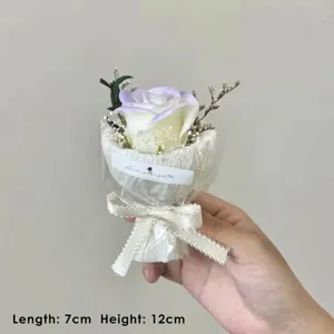 Detail shot of artificial rose bouquet with ribbon bow, mini size flower gift for teachers.