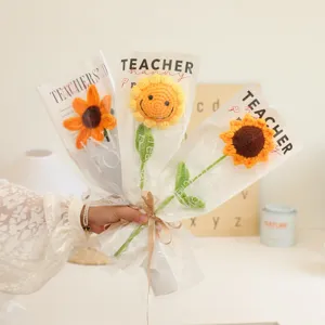 Handmade crochet sunflower bouquet in transparent packaging for teacher day gift.
