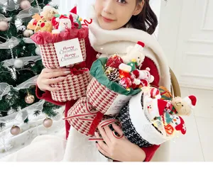 Christmas plush toy bouquet detail shot with cute Santa and bear dolls, warm LED lights.