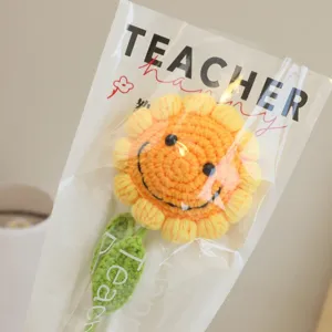 Handmade crochet sunflower bouquet with happy face design, perfect teacher day gift wrap.