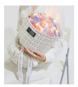 Detail view of the handmade tweed soap flower bouquet with pearls, LED lights and ribbons.