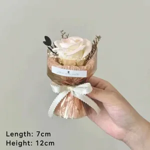 Detail view of mini artificial rose bouquet, handmade scented flower gift with ribbon decoration.