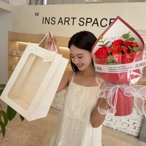 Red soap flower bouquet with white gift bag for Mother's Day and Valentine's Day gifts.