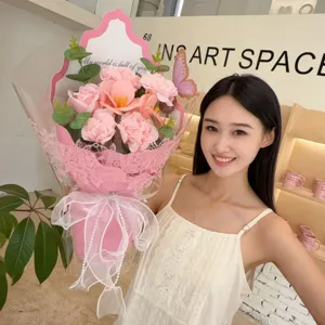 Detailed view of a pink soap flower bouquet held by a model for Mother's Day