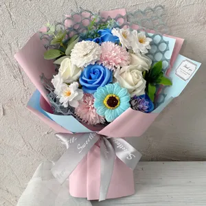 Elegant artificial carnation and soap flower bouquet in pink and blue gift wrap
