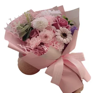Elegant pink soap flower bouquet with carnations and roses in decorative pink wrapping