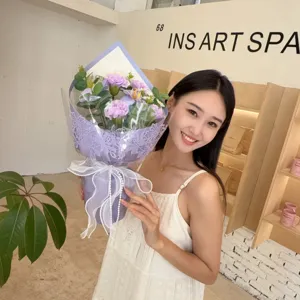Asian model holding elegant purple soap flower bouquet with carnations for Mother's Day