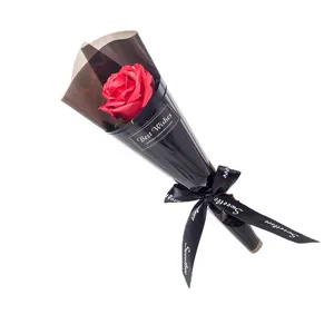 Single red rose soap flower bouquet wrapped in black paper with ribbon gift for festival birthday