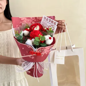 Detail view of handmade crochet carnation flower bouquet with Chinese style red wrapping.