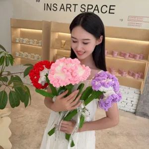 Beautiful handmade crochet carnation bouquet held by a smiling model in a lifestyle setting