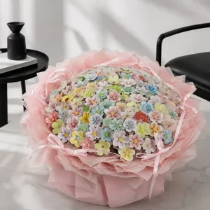 Exquisite handmade ceramic flower bouquet in dopamine colors, wrapped in pink gift paper.