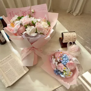 Detailed view of pink and white soap flower bouquets with Mother's Day toppers.