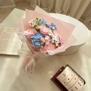 Close-up of a romantic pink and blue soap rose bouquet with elegant gift wrapping