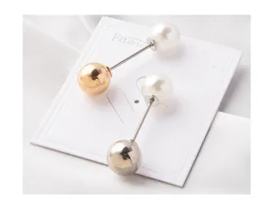Close-up of elegant pearl and metallic bead anti-exposure brooch pins displayed on white card