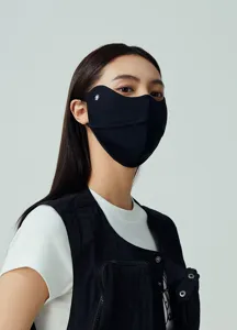 Detailed side view of a black 3D nylon sun protection face mask worn by a model