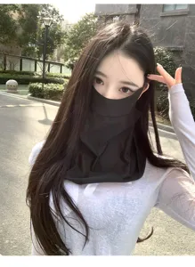 Close-up of a black sun protection mask showing the full neck coverage and fit on face