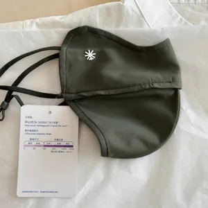 Professional dark olive 3D sun protection mask with UV intensity testing tag and snowflake logo