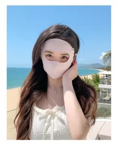 Sun protection face mask detail shot, outdoor beach scene, breathable fabric for women.