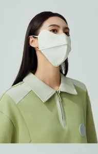 Detail view of a 3D breathable UV protection sun mask in white nylon fabric.