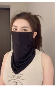 Close-up of a breathable mesh sun protection mask worn by a female model