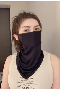 Close-up detail of a breathable black mesh sun protection face mask and neck gaiter for women