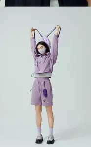 Model wearing a 3D breathable UV protection face mask and purple sports apparel