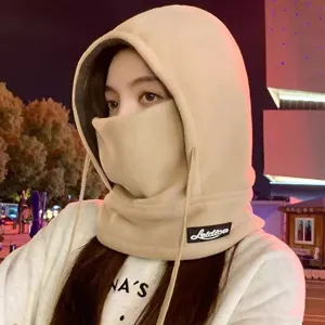 Detailed view of the winter warm fleece hooded hat with face mask, soft texture close-up.