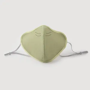 Detailed view of a light green velvet dustproof windproof mask with adjustable ear loops.