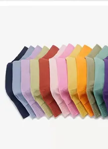 Detail view of solid color bucket hats in various vibrant shades, breathable cotton fabric.