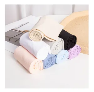 Detailed view of colorful rolled up ice sleeves showing soft fabric and assorted pastel shades.