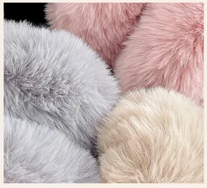 Detailed macro view showing the soft plush faux fur texture of warm winter earmuffs
