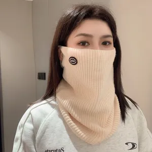 Beige knitted neck gaiter for winter, thick outdoor thermal protective neck warmer.