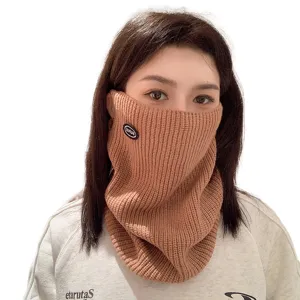 Young Asian woman wearing a warm brown knitted winter neck gaiter for outdoor protection