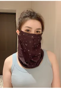 Detailed view of breathable ice silk face mask with star pattern for outdoor sun protection.