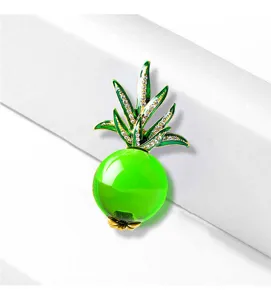 Close-up of a 3D green pineapple brooch with jelly glaze and crystal-set leaves