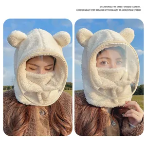 Detailed view of plush bear ear winter hat with integrated face shield and mask