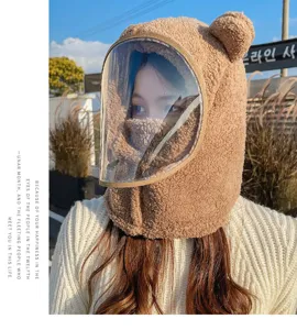 Detail showing plush bear ear hat with integrated transparent protective face shield