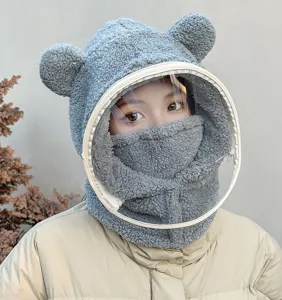 Detail of the cute bear ears and detachable anti-fog face shield on the fuzzy winter hat.