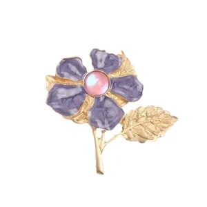 Elegant purple cherry blossom flower brooch with pink cat-eye stone and golden leaves