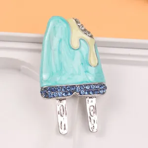 Detailed view of a cute blue enamel popsicle brooch featuring sparkling blue rhinestones