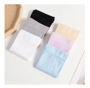 Group of colorful ice silk sun protection sleeves folded neatly on a white surface.