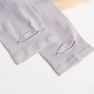 Close-up of light grey ice silk cooling arm sleeves with thumb hole for sun protection