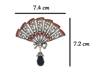 Vintage waaierspeld met rode steentjes en zwart kristal, afmetingen 7,4x7,2 cm.