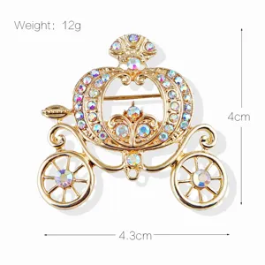Detail view of a golden Cinderella pumpkin carriage brooch with dimensions and weight info.