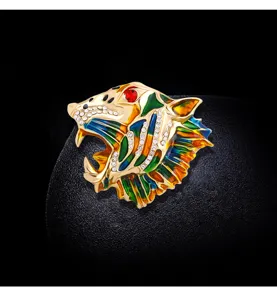 Close-up of vintage tiger head brooch with colorful enamel and sparkling rhinestones
