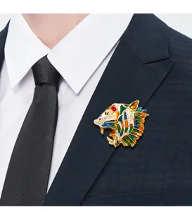 Detailed macro view of the vintage tiger head brooch pinned onto a classic suit lapel