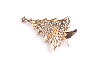 Detailed close-up showing the back of a gold alloy Christmas tree brooch with texture pattern