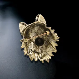 Vintage gold-tone wolf head totem brooch featuring a secure pin back for suit lapels