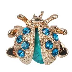 Cute cartoon ladybug brooch with blue rhinestones and turquoise stone embellishment
