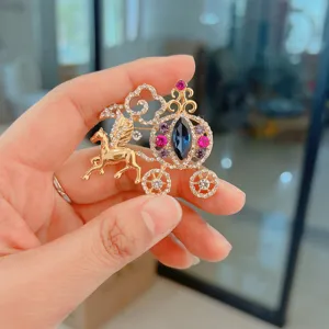 Elegant gold-plated hollow pumpkin carriage brooch with colorful rhinestones and winged horse